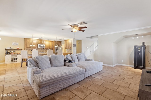 12748 N 57th Dr, Glendale, AZ 85304 - living area with a ceiling fan, stairway, and baseboards