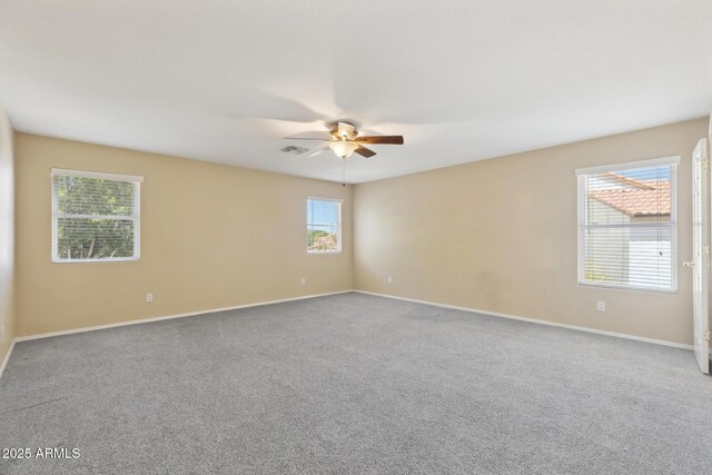 12748 N 57th Dr, Glendale, AZ 85304 - empty room featuring a ceiling fan, carpet floors, and baseboards
