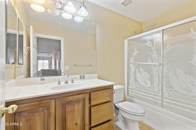 12748 N 57th Dr, Glendale, AZ 85304 - full bathroom featuring vanity, toilet, and shower / bath combination with glass door