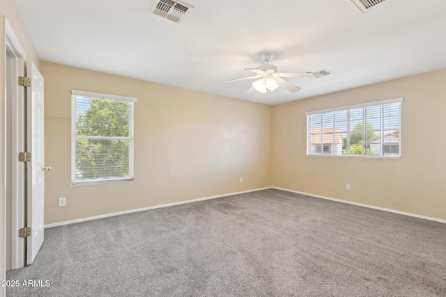 12748 N 57th Dr, Glendale, AZ 85304 - unfurnished bedroom featuring multiple windows, carpet, and baseboards