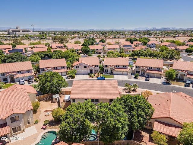 12748 N 57th Dr, Glendale, AZ 85304 - aerial perspective of suburban area featuring a mountain backdrop and a pool area