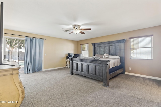 12748 N 57th Dr, Glendale, AZ 85304 - bedroom with access to outside, multiple windows, and baseboards