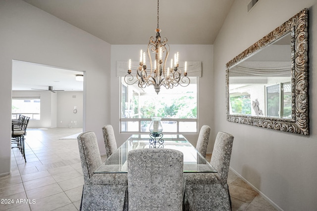 dining room featuring ceiling fan with notable chandelier and light tile patterned floors