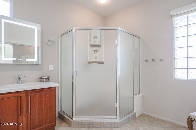 bathroom with vanity and a shower with shower door