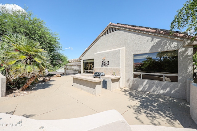 view of patio / terrace with a grill and area for grilling