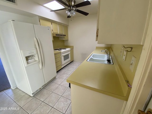 kitchen with ceiling fan, light tile patterned flooring, sink, and white appliances