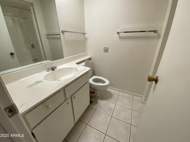 bathroom with vanity, toilet, tile patterned flooring, and walk in shower