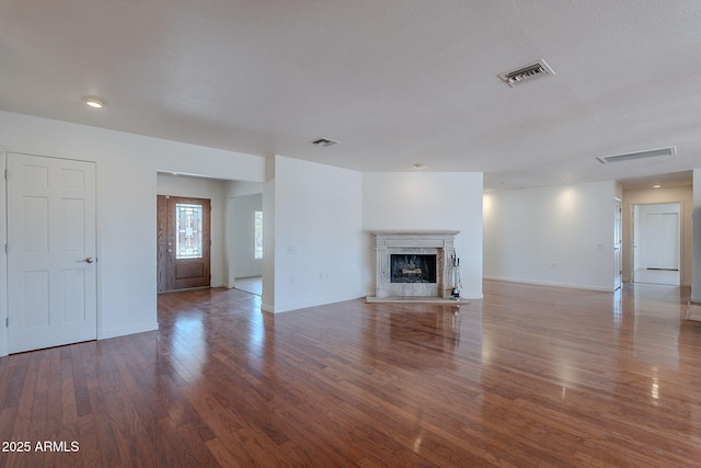 5539 E Dahlia Dr, Scottsdale, AZ 85254 - unfurnished living room featuring wood finished floors, baseboards, and a fireplace