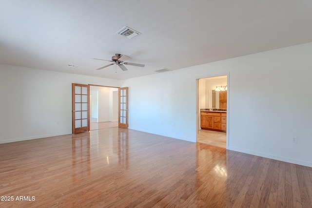 5539 E Dahlia Dr, Scottsdale, AZ 85254 - spare room featuring ceiling fan, light wood-type flooring, and baseboards