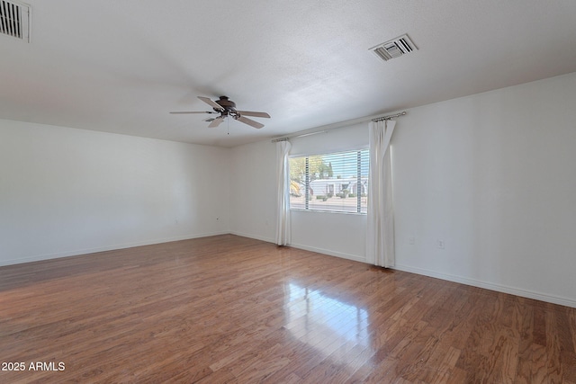 5539 E Dahlia Dr, Scottsdale, AZ 85254 - empty room with ceiling fan, wood finished floors, and baseboards