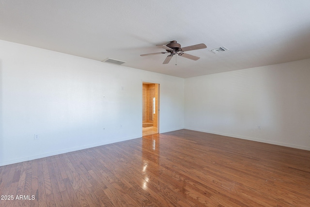 5539 E Dahlia Dr, Scottsdale, AZ 85254 - empty room featuring a ceiling fan, baseboards, and wood finished floors