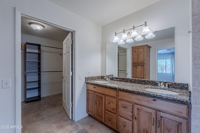5539 E Dahlia Dr, Scottsdale, AZ 85254 - full bathroom with double vanity and baseboards