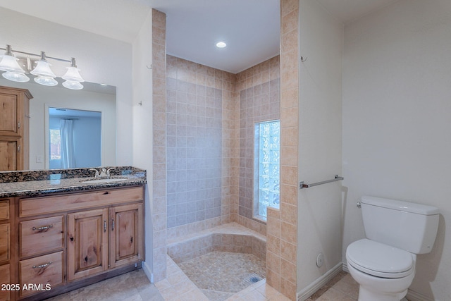 5539 E Dahlia Dr, Scottsdale, AZ 85254 - full bathroom with vanity, tiled shower, toilet, tile patterned flooring, and baseboards