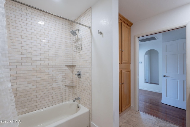 5539 E Dahlia Dr, Scottsdale, AZ 85254 - bathroom featuring shower / bathtub combination with curtain, tile patterned flooring, and baseboards