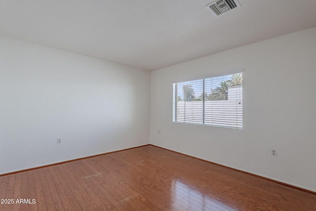 5539 E Dahlia Dr, Scottsdale, AZ 85254 - unfurnished room featuring wood finished floors and baseboards