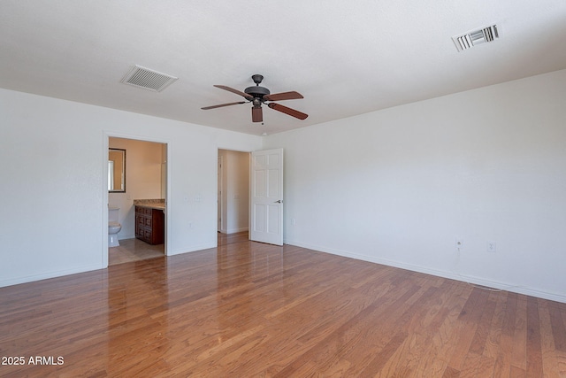 5539 E Dahlia Dr, Scottsdale, AZ 85254 - spare room featuring ceiling fan, baseboards, and light wood finished floors