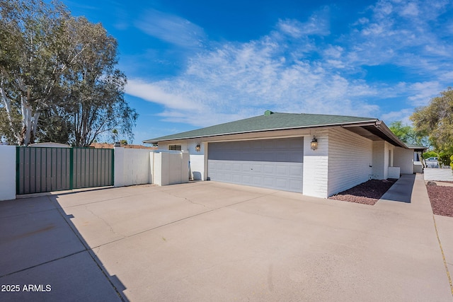 5539 E Dahlia Dr, Scottsdale, AZ 85254 - view of home's exterior featuring a gate and brick siding