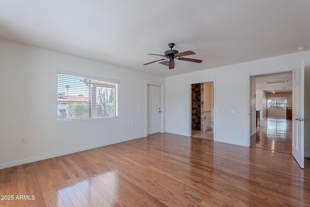 5539 E Dahlia Dr, Scottsdale, AZ 85254 - unfurnished bedroom featuring light wood-style flooring, baseboards, and ceiling fan
