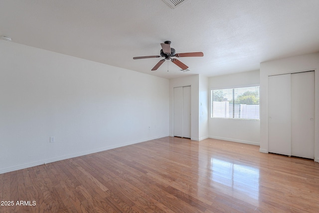 5539 E Dahlia Dr, Scottsdale, AZ 85254 - unfurnished room with light wood-style flooring, a ceiling fan, and baseboards
