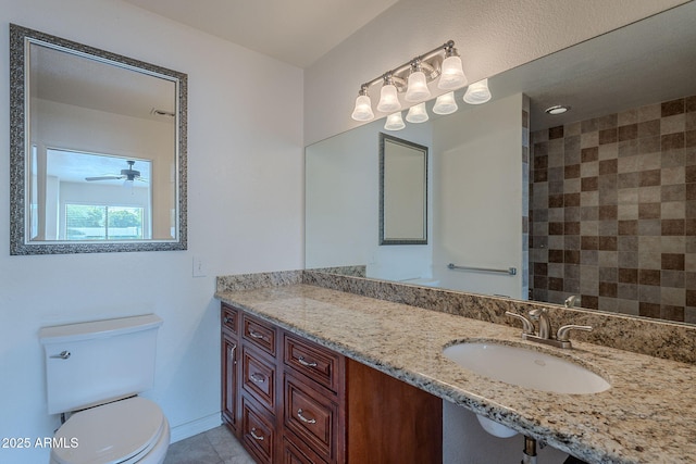 5539 E Dahlia Dr, Scottsdale, AZ 85254 - full bathroom with toilet, tile patterned flooring, ceiling fan, and vanity