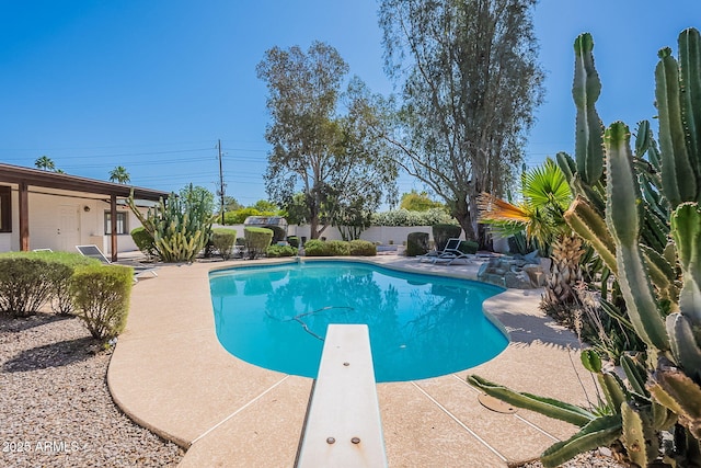 5539 E Dahlia Dr, Scottsdale, AZ 85254 - view of swimming pool with a diving board and a patio area