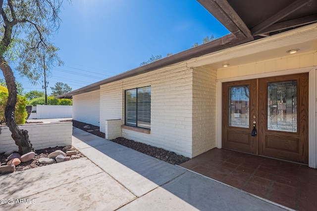 5539 E Dahlia Dr, Scottsdale, AZ 85254 - doorway to property with french doors and brick siding