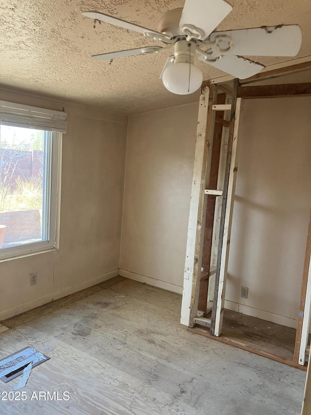 empty room featuring ceiling fan