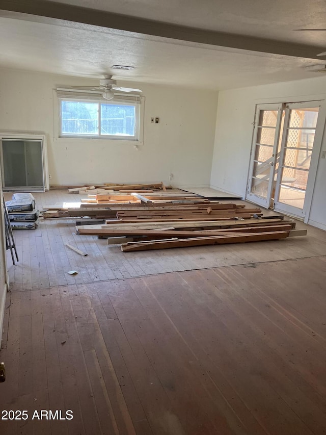 unfurnished room featuring hardwood / wood-style flooring and ceiling fan