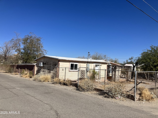 manufactured / mobile home with a wall mounted AC