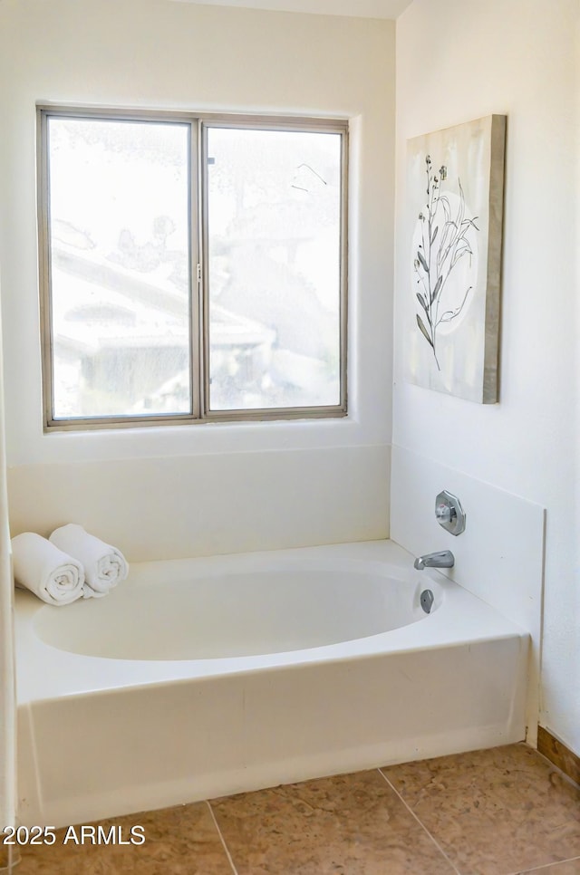 full bath featuring tile patterned flooring and a bath