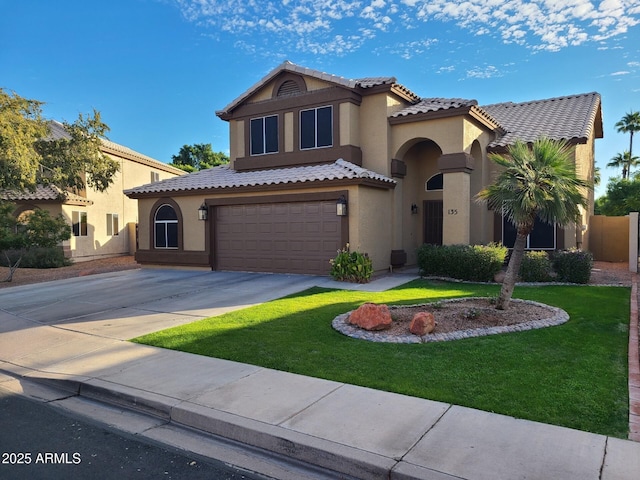 135 S Abalone Dr, Gilbert, AZ 85233 - mediterranean / spanish home featuring stucco siding, a garage, a tile roof, and concrete driveway