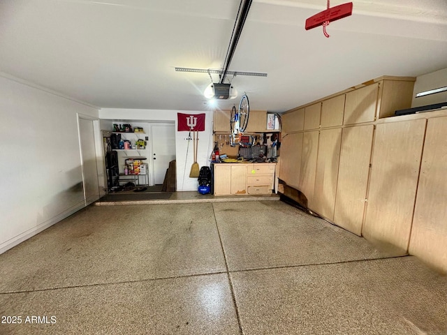 135 S Abalone Dr, Gilbert, AZ 85233 - garage with a garage door opener and a workshop area
