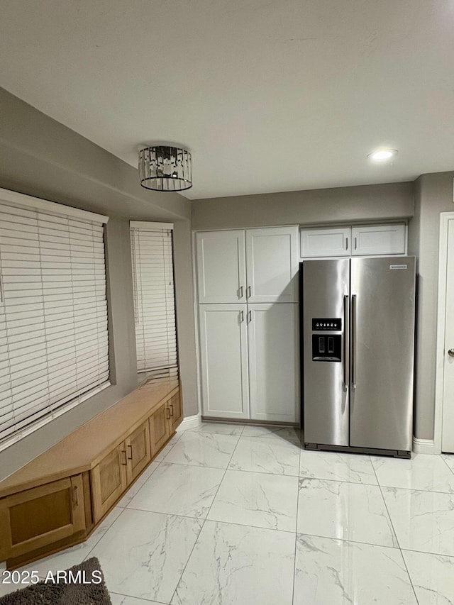 135 S Abalone Dr, Gilbert, AZ 85233 - kitchen with stainless steel refrigerator with ice dispenser, light marble finish floors, recessed lighting, and baseboards