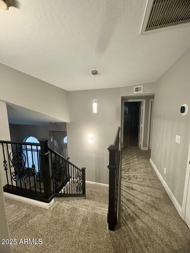 135 S Abalone Dr, Gilbert, AZ 85233 - stairway featuring carpet floors, baseboards, and a textured ceiling