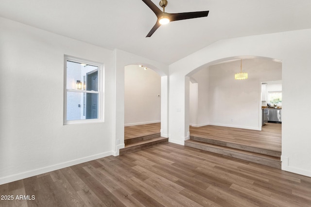 3037 E Bighorn Ave, Phoenix, AZ 85048 - empty room with lofted ceiling, wood finished floors, a ceiling fan, and baseboards
