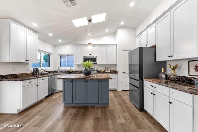 3037 E Bighorn Ave, Phoenix, AZ 85048 - kitchen featuring white cabinetry, stainless steel appliances, and dark stone counters