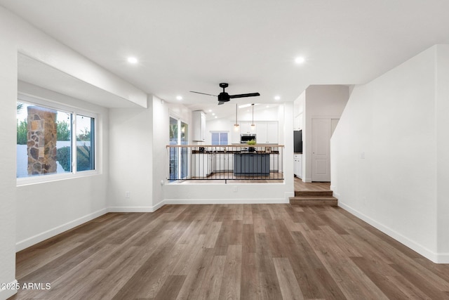 3037 E Bighorn Ave, Phoenix, AZ 85048 - unfurnished living room with ceiling fan, baseboards, wood finished floors, and recessed lighting