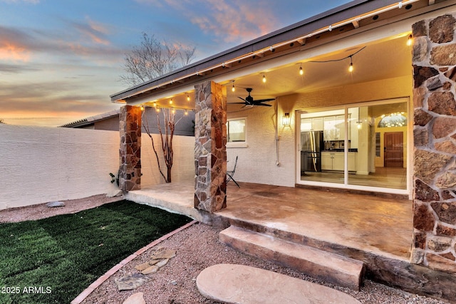 3037 E Bighorn Ave, Phoenix, AZ 85048 - patio terrace at dusk featuring fence and a ceiling fan