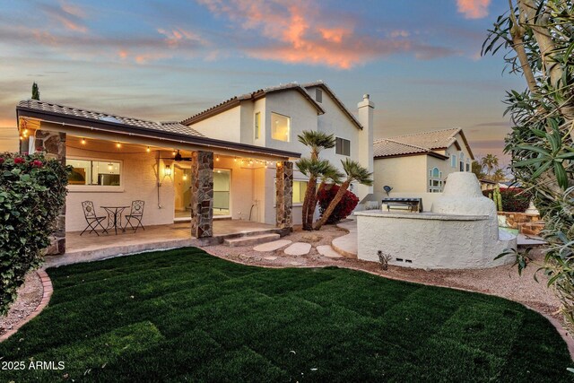 3037 E Bighorn Ave, Phoenix, AZ 85048 - rear view of property with a patio area, a yard, area for grilling, and stucco siding