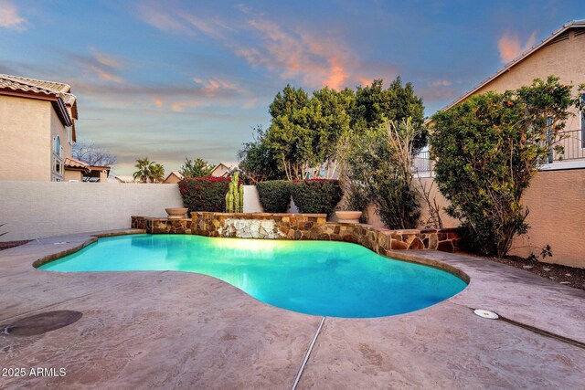 3037 E Bighorn Ave, Phoenix, AZ 85048 - pool at dusk featuring a fenced in pool, a fenced backyard, and a patio