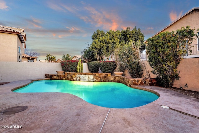 3037 E Bighorn Ave, Phoenix, AZ 85048 - pool at dusk with a patio area, a fenced backyard, and a fenced in pool