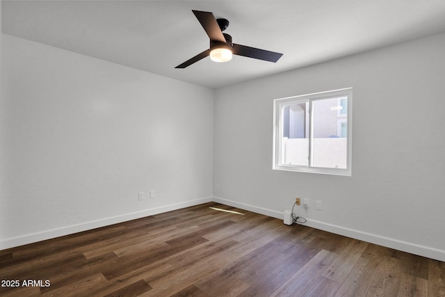 3037 E Bighorn Ave, Phoenix, AZ 85048 - unfurnished room featuring a ceiling fan, dark wood-style flooring, and baseboards