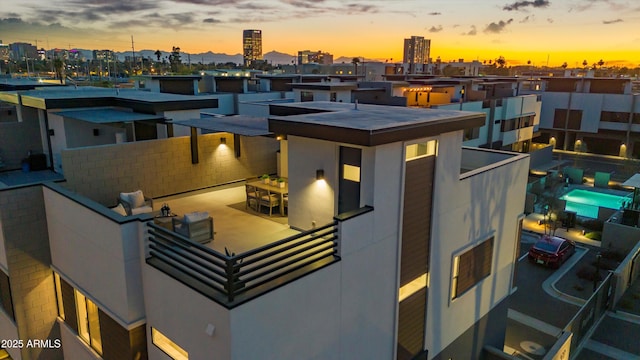 exterior space with a balcony and a city view