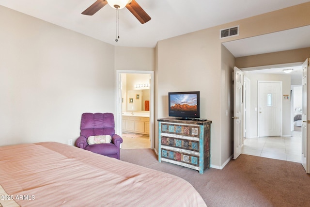 9555 E Raintree Dr E Unit 2061, Scottsdale, AZ 85260 - bedroom with visible vents, light carpet, ensuite bath, baseboards, and ceiling fan