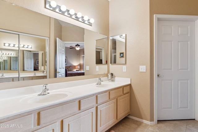 9555 E Raintree Dr E Unit 2061, Scottsdale, AZ 85260 - bathroom featuring tile patterned floors, a ceiling fan, ensuite bath, and a sink
