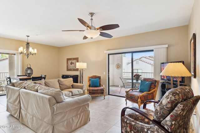 9555 E Raintree Dr E Unit 2061, Scottsdale, AZ 85260 - living room featuring ceiling fan with notable chandelier, plenty of natural light, and light tile patterned floors