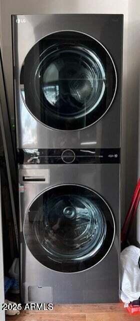 laundry area featuring stacked washer and dryer