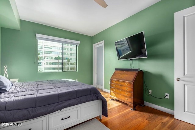 bedroom featuring ceiling fan and light hardwood / wood-style floors