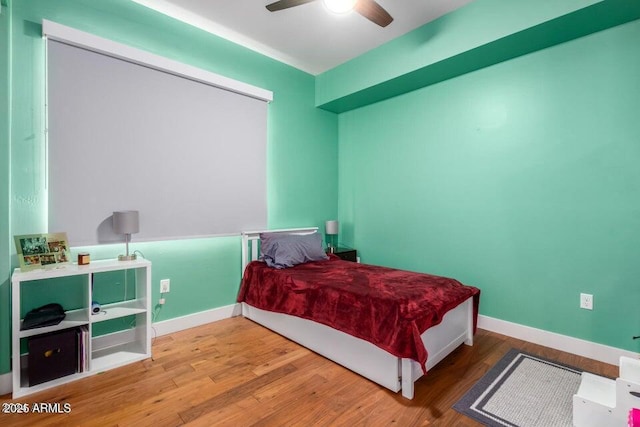 bedroom featuring wood-type flooring and ceiling fan