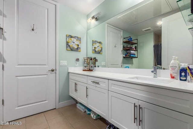 bathroom featuring vanity, tile patterned floors, and walk in shower